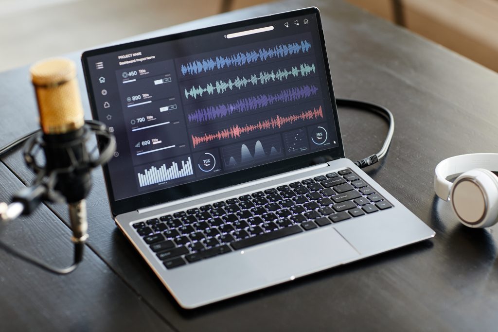 A picture of a laptop audio recording software showing the spikes of the audio